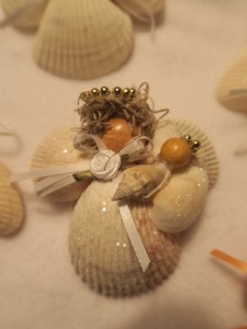 Seashell angels. This one holds a baby.